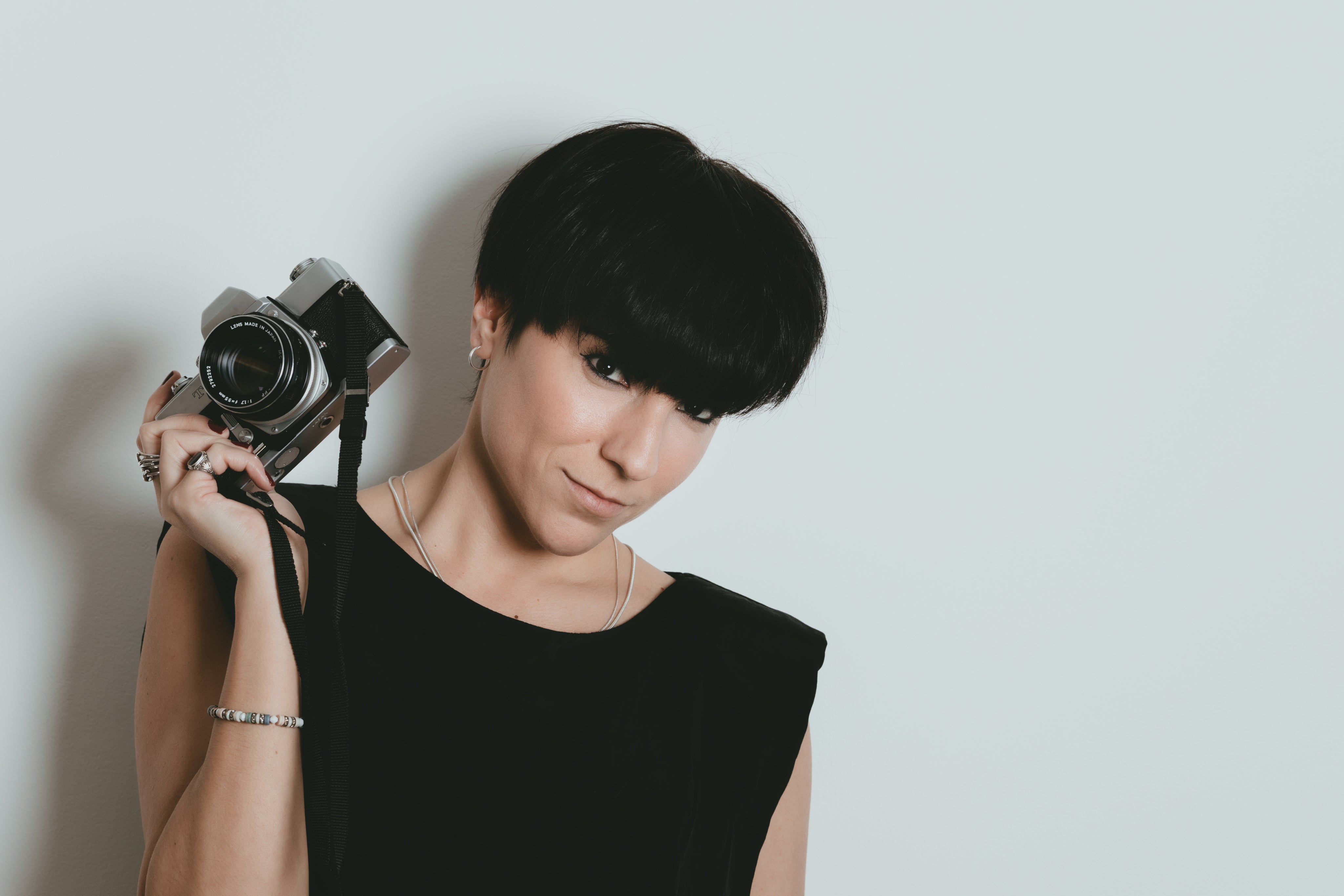 files/female-photographer-holds-up-her-camera.jpg